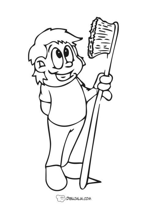 Niño con cepillo de dientes